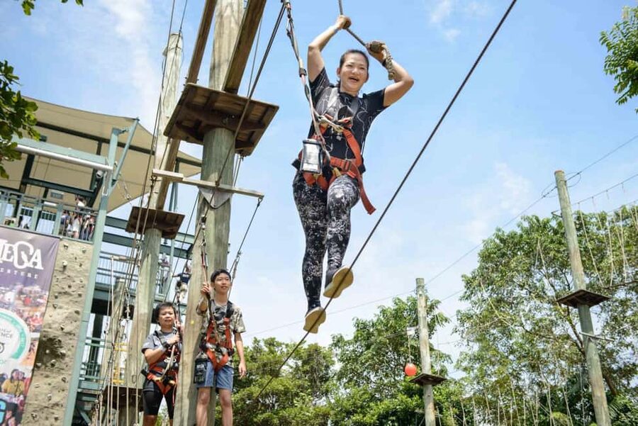 Sentosa Island: Ticket to Mega Adventure Park - MegaBounce, flips above Siloso Beach