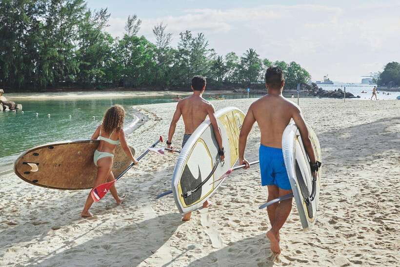 Singapore: Stand up Paddle board - Ola Beach Club Ticket - Getting onto the board for the first time